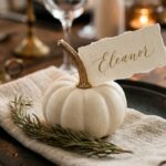 DIY mini white pumpkin place card holder on dark plate with calligraphy deckle edge card