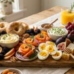 Abundant fall brunch charcuterie board with bagels, smoked salmon roses, whipped honey butter, and fresh figs
