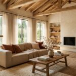 Architectural photography of a warm earthy living room with oatmeal sofa, reclaimed oak table, and layered rugs